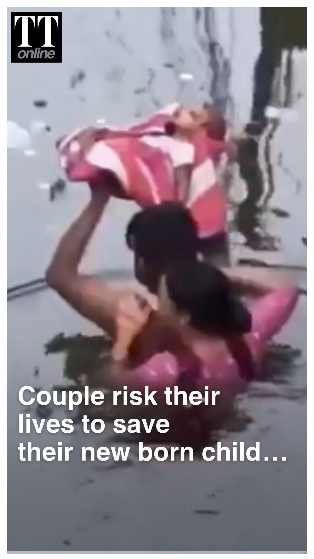Parents Carry Infant Over their Head Through Waist-Deep Floodwaters in UP’s Prayagraj