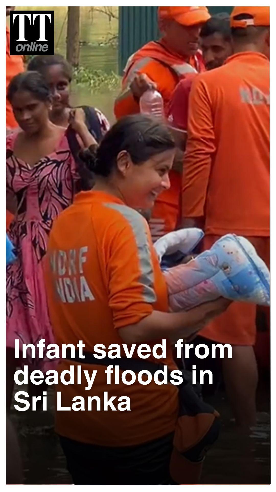 Indian NDRF Woman Comforts Rescued Infant in Flood-Stricken Sri Lanka